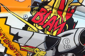 Comic artwork with a BLAM sound effect