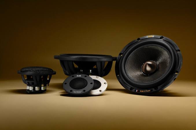 BLAM audio speakers on a gold background
